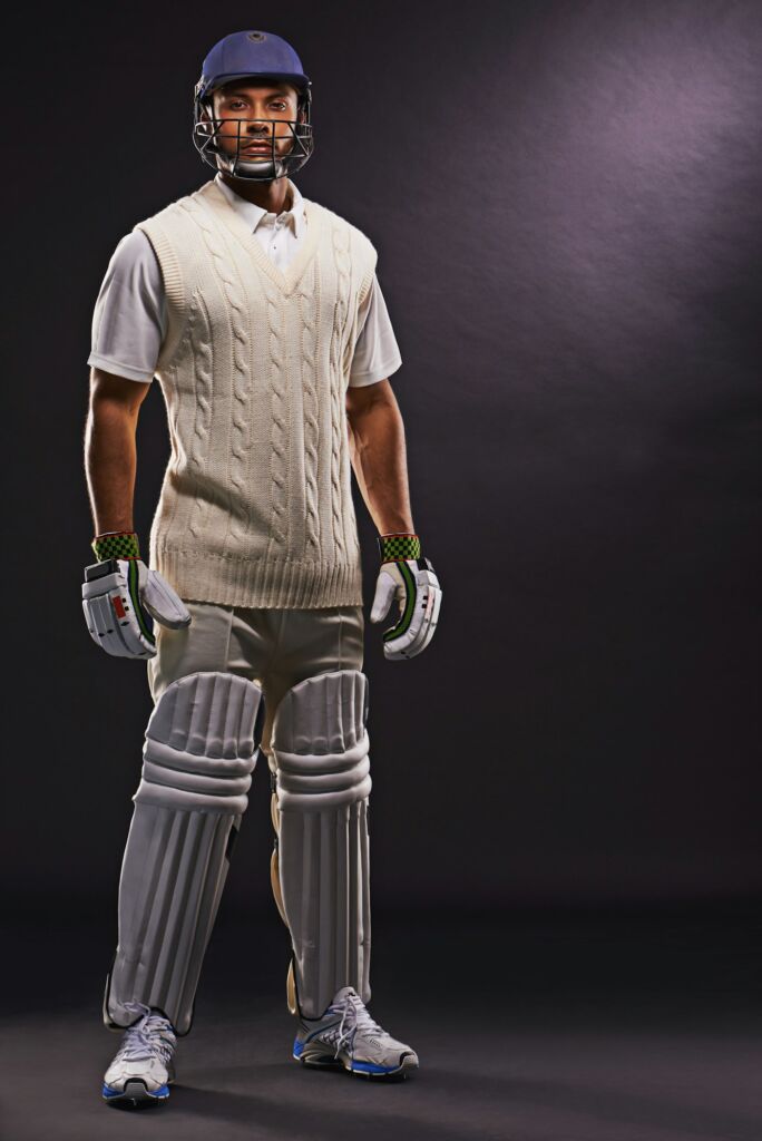 Ready to hit the pitch. A cropped shot of an ethnic young man in cricket attire isolated on black.