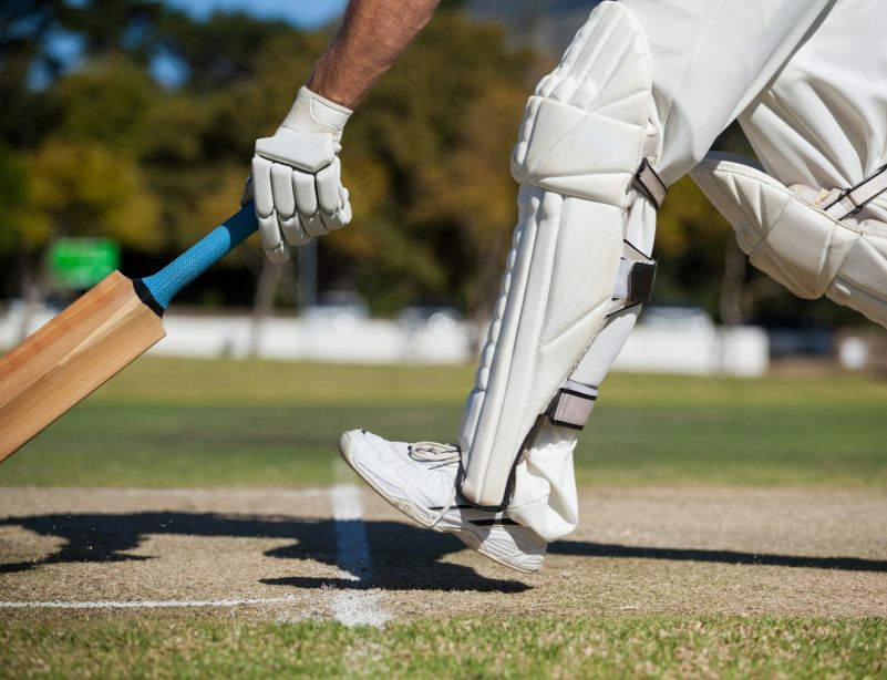 Cricket player scoring run on field